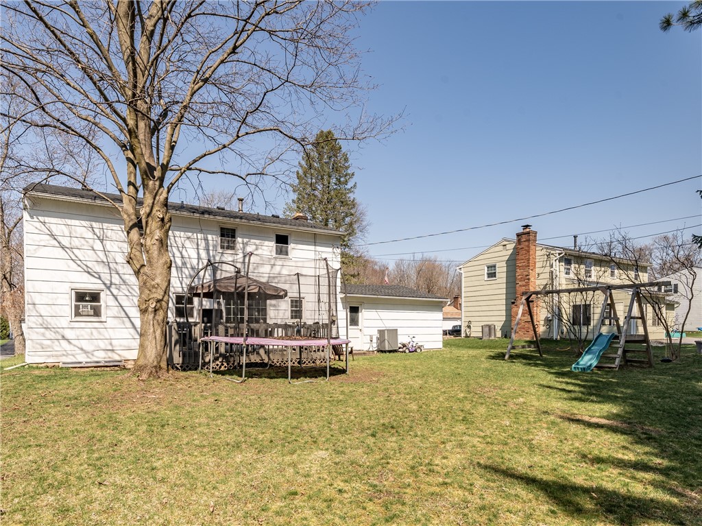 52 Lambeth Loop Perinton, NY 14450 - Photo 31 of 34 Rear yard with deck - owner just had 11 trees remo