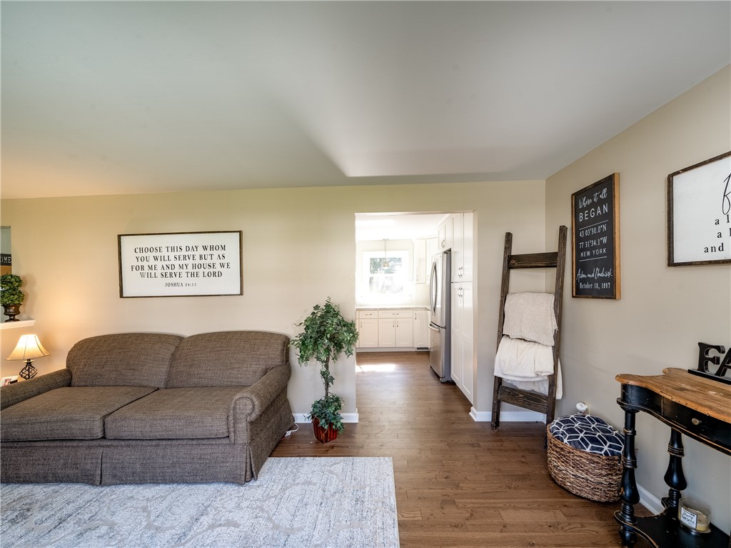 52 Lambeth Loop Perinton, NY 14450 - Photo 6 of 34 Formal living room entering into new kitchen with