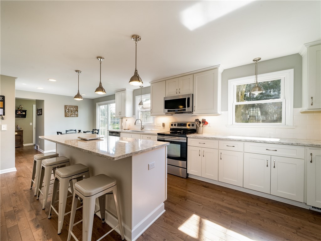 52 Lambeth Loop Perinton, NY 14450 - Photo 7 of 34 Stunning 50K kitchen with huge island and quartz c