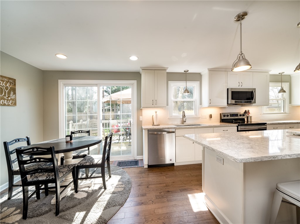 52 Lambeth Loop Perinton, NY 14450 - Photo 9 of 34 Dinette area to sliders which enter onto rear deck