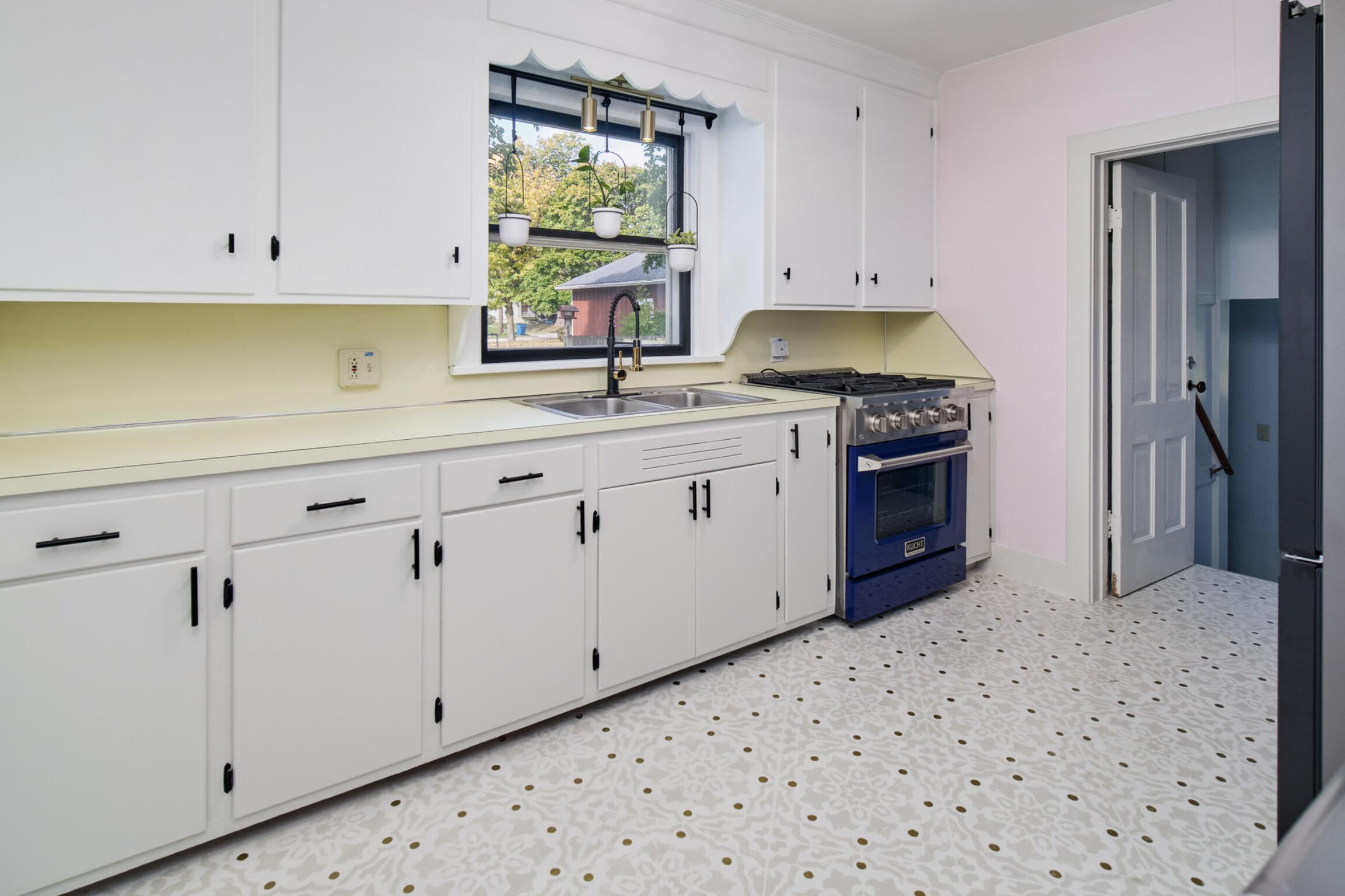 244 5th Street Manistee, MI 49660 - Photo 10 of 45 Totally updated black and white kitchen