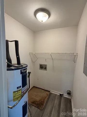 a view of storage and utility room with racks on the wall