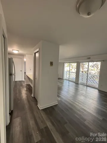 a view of livingroom and hardwood floor