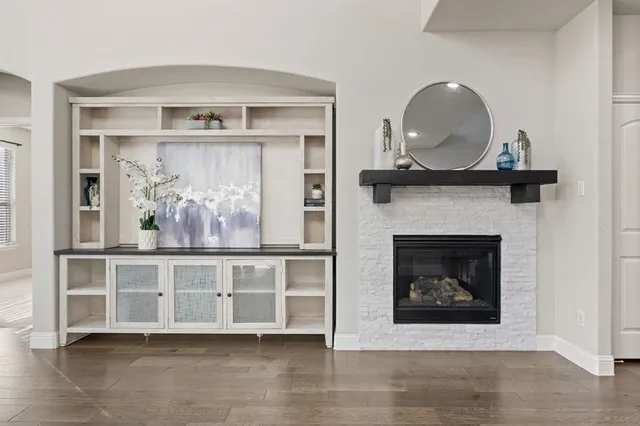 a front view of a fireplace with wooden floor