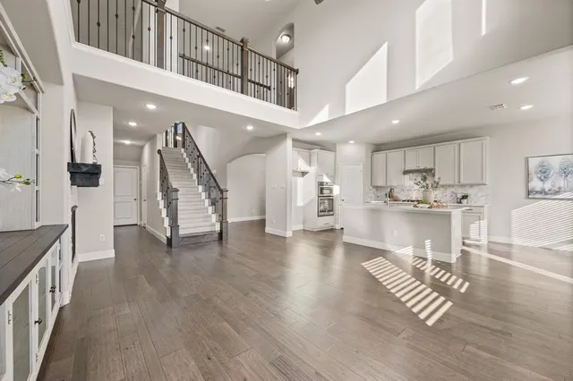 a view of an entryway with wooden floor