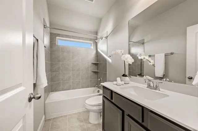 an empty room with closet and a chandelier fan