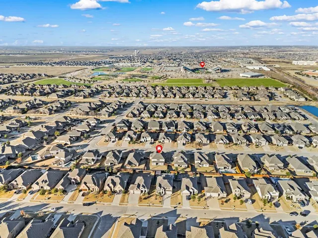 a view of a swimming pool with a table and chairs