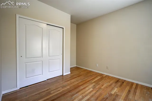 a view of an empty room with a fireplace