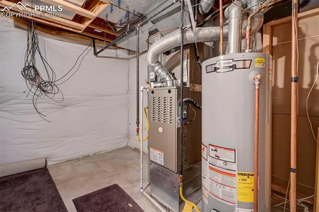 a view of backyard with table and chairs and potted plants