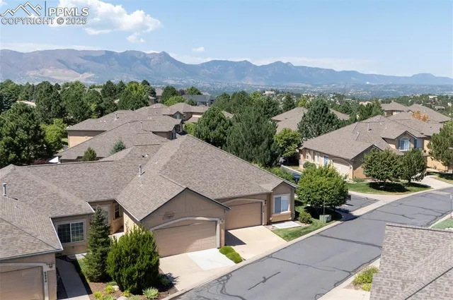 an aerial view of a house with a garden