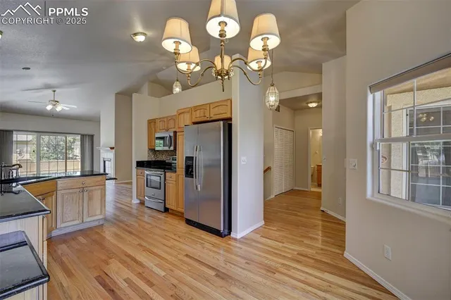 a view of a kitchen from the hallway