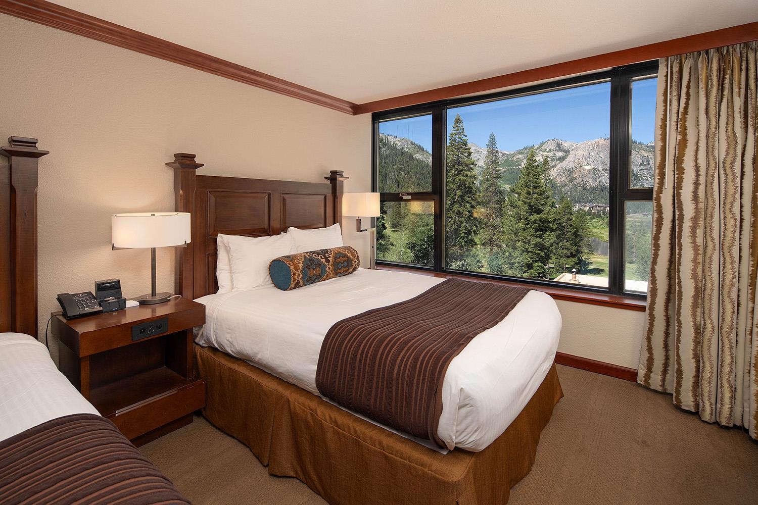400 Resort Road, Unit 556 558 560 Olympic Valley, CA 96146 - Photo 14 of 21 a bedroom with a bed and a large window