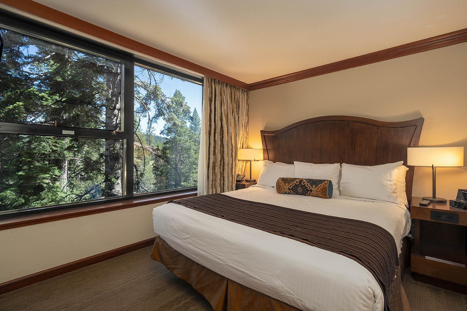 400 Resort Road, Unit 556 558 560 Olympic Valley, CA 96146 - Photo 9 of 21 a bedroom with a large bed and a large window