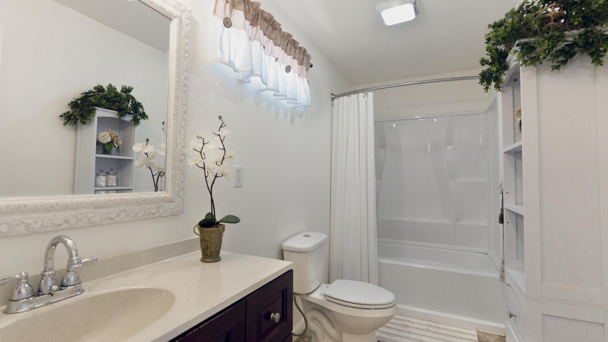 20577 Sunset Lane Redding, CA 96002 - Photo 11 of 29 a bathroom with a sink toilet and shower