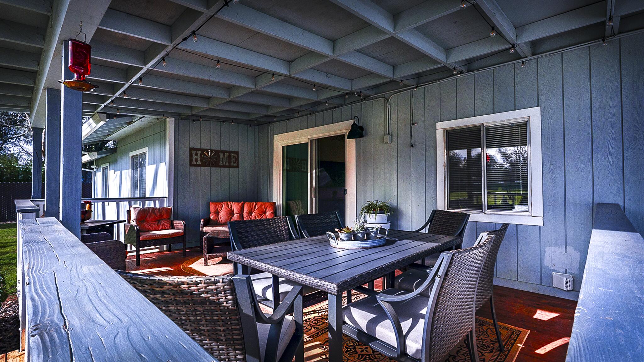 20577 Sunset Lane Redding, CA 96002 - Photo 24 of 29 a outdoor dining space with furniture and wooden floor