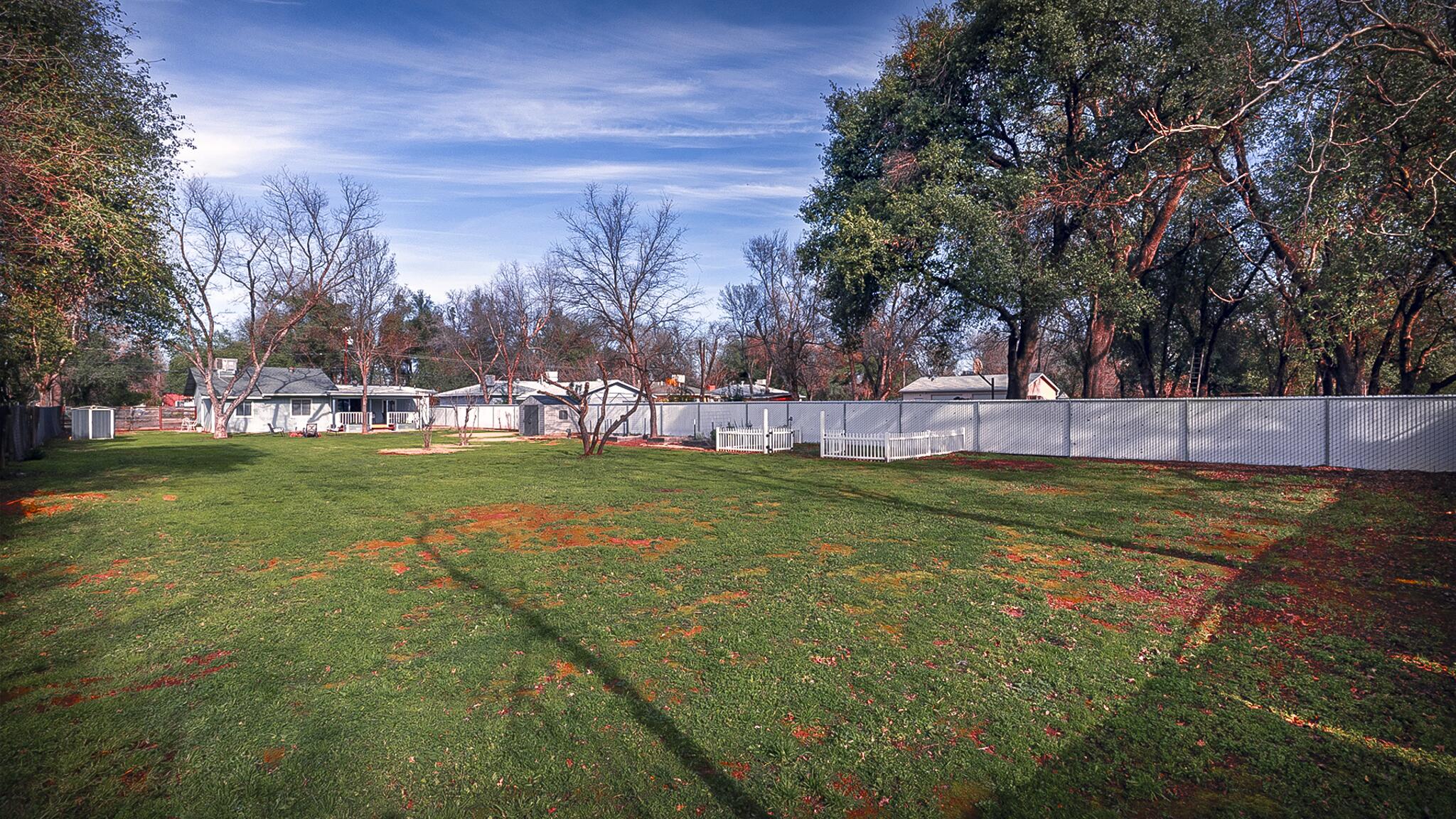 20577 Sunset Lane Redding, CA 96002 - Photo 26 of 29 a view of yard with swimming pool and green space