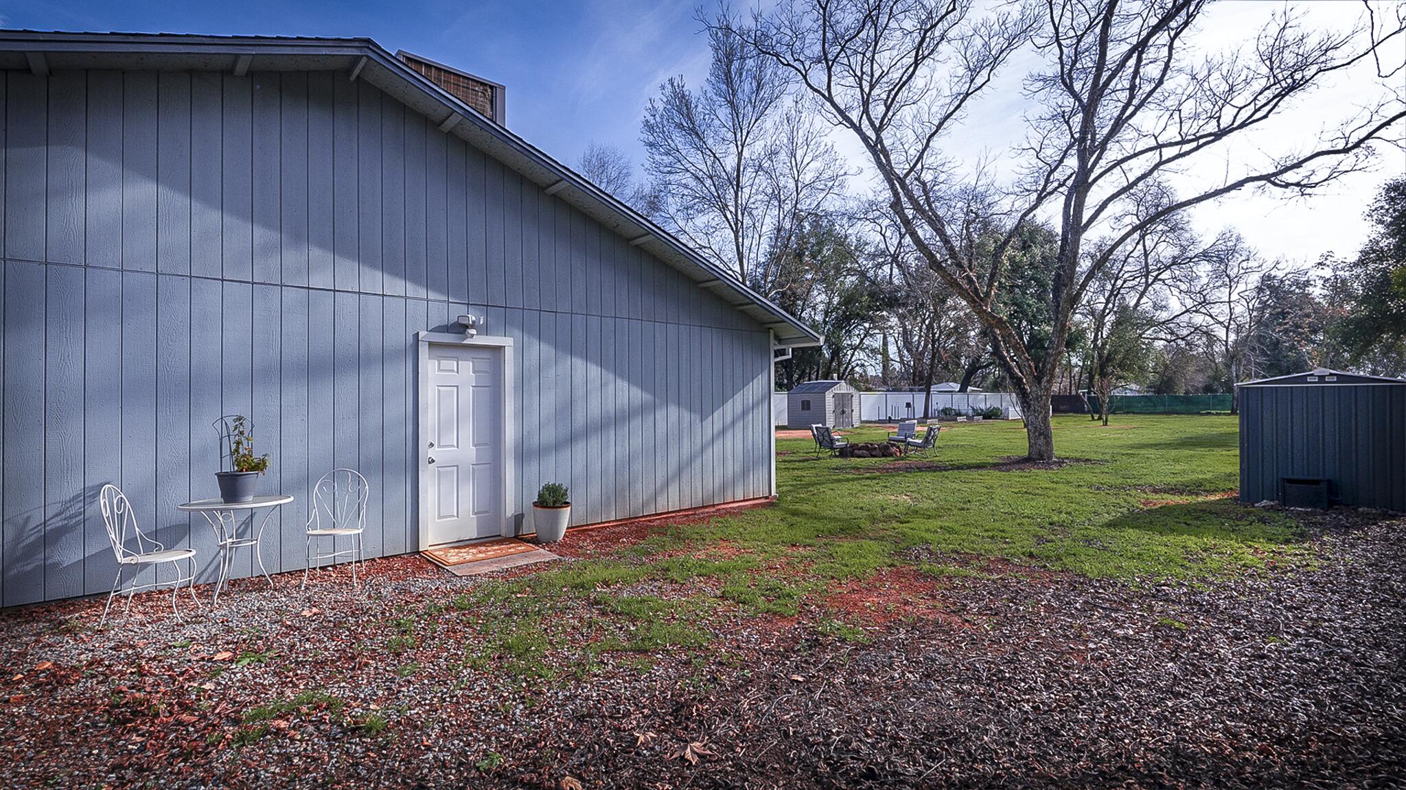 20577 Sunset Lane Redding, CA 96002 - Photo 29 of 29 a backyard of a house with lots of green space