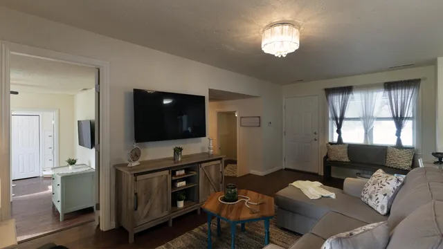 a living room with furniture and a flat screen tv