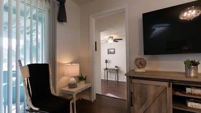 a room with furniture and flat screen tv