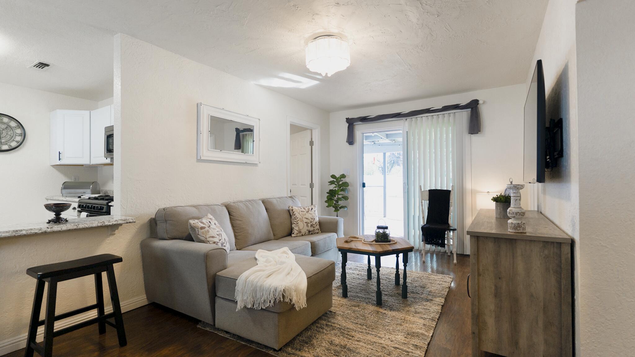 20577 Sunset Lane Redding, CA 96002 - Photo 6 of 29 a living room with furniture and a flat screen tv