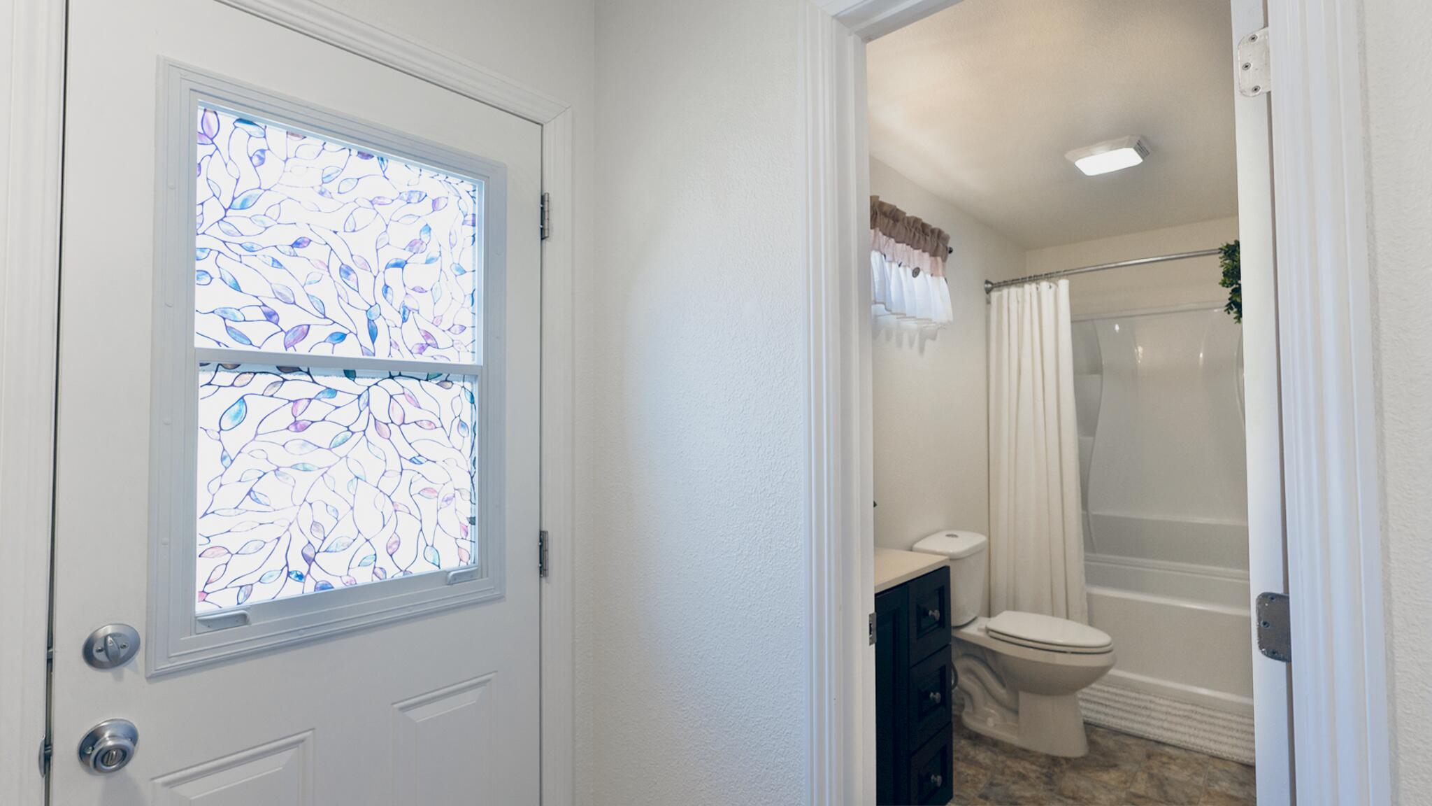 20577 Sunset Lane Redding, CA 96002 - Photo 10 of 29 a bathroom with a granite countertop toilet a sink and a large mirror