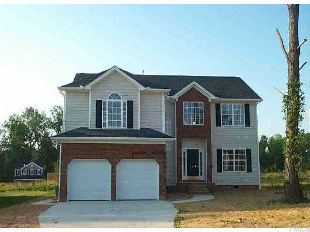 349 Seastone Street Raleigh, NC 27603 - Photo 1 of 1 a front view of a house with a garden