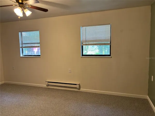 a view of room with a ceiling fan
