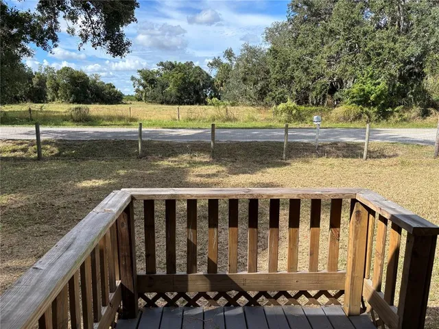 a view of a backyard with trees