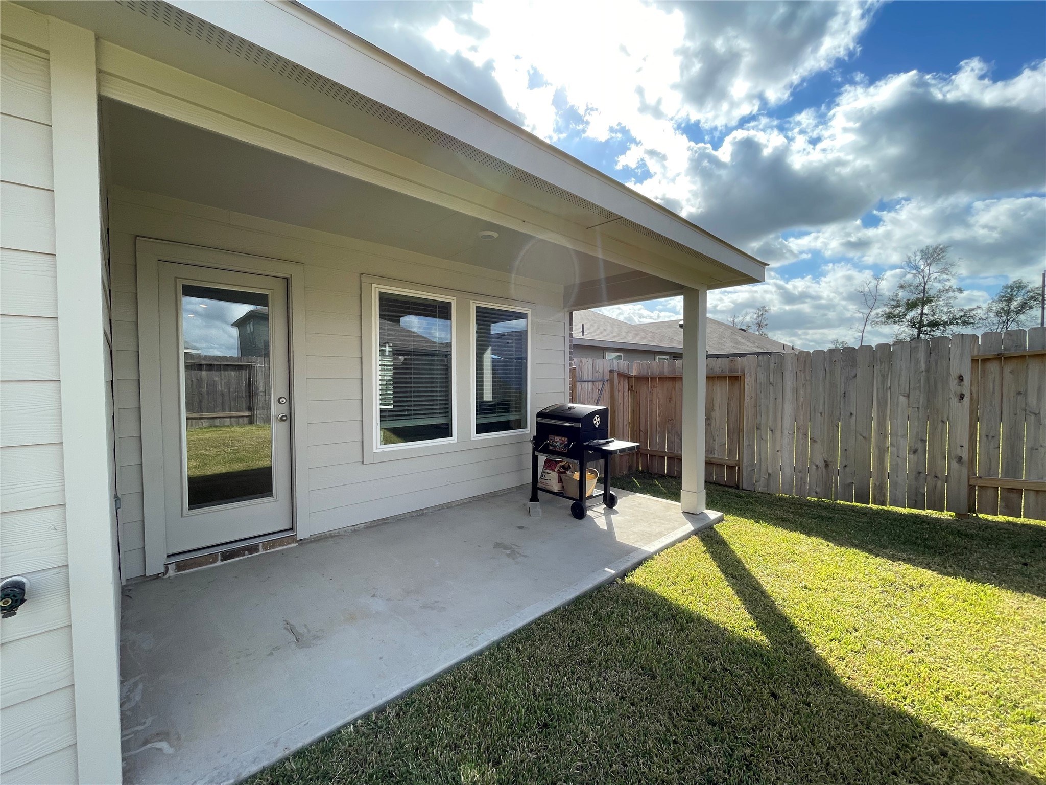 23811 Desert Brush Ct Spring Spring, TX 77373 - Photo 12 of 24 a view of backyard with a chair and table in the patio