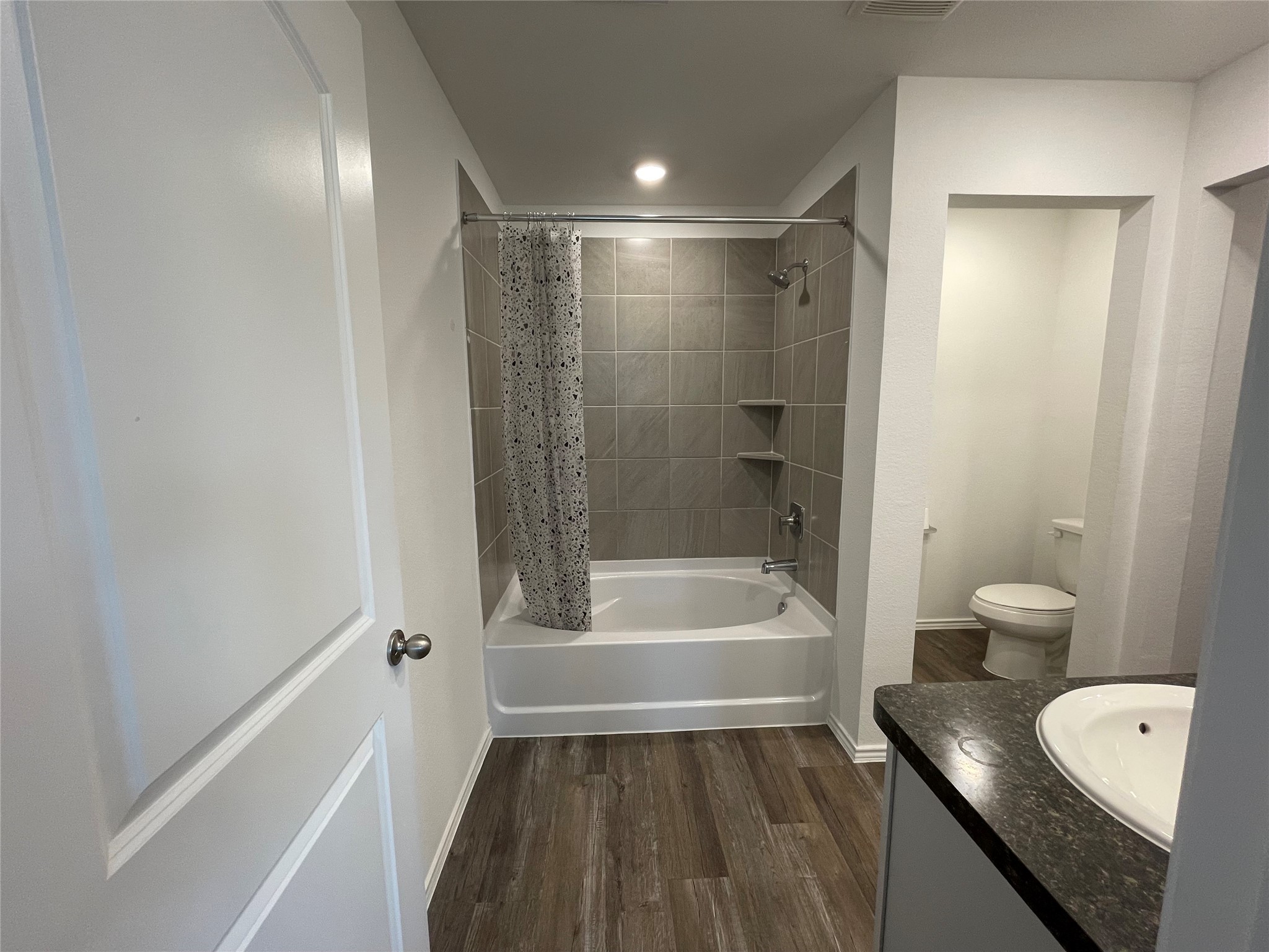 23811 Desert Brush Ct Spring Spring, TX 77373 - Photo 17 of 24 a bathroom with a bathtub a toilet and a shower