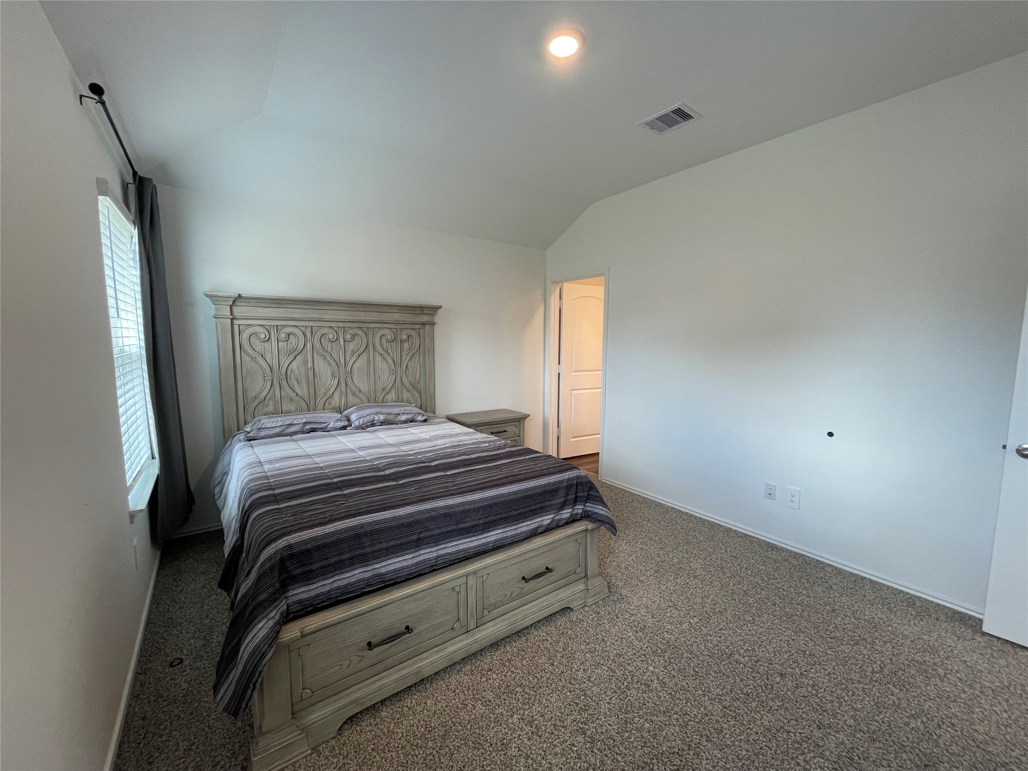 23811 Desert Brush Ct Spring Spring, TX 77373 - Photo 18 of 24 a bedroom with a bed and a mirror