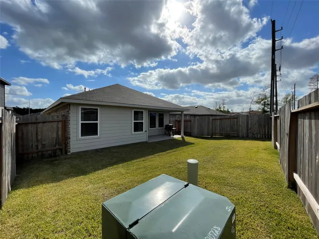a view of a backyard with a tub