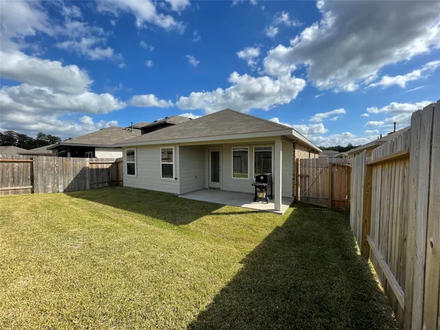 a front view of house with yard and seating area