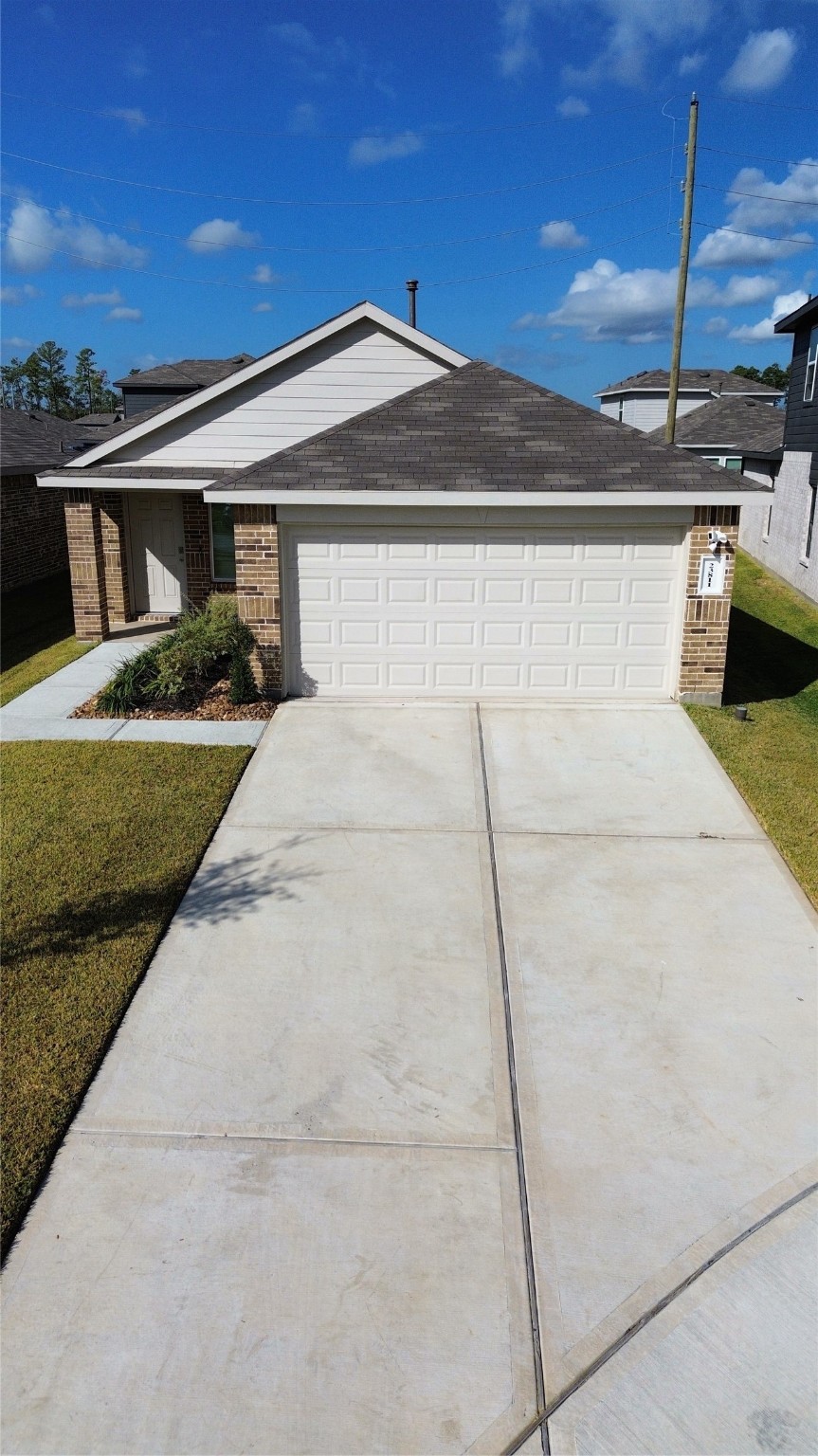 23811 Desert Brush Ct Spring Spring, TX 77373 - Photo 4 of 24 a front view of a house with a yard