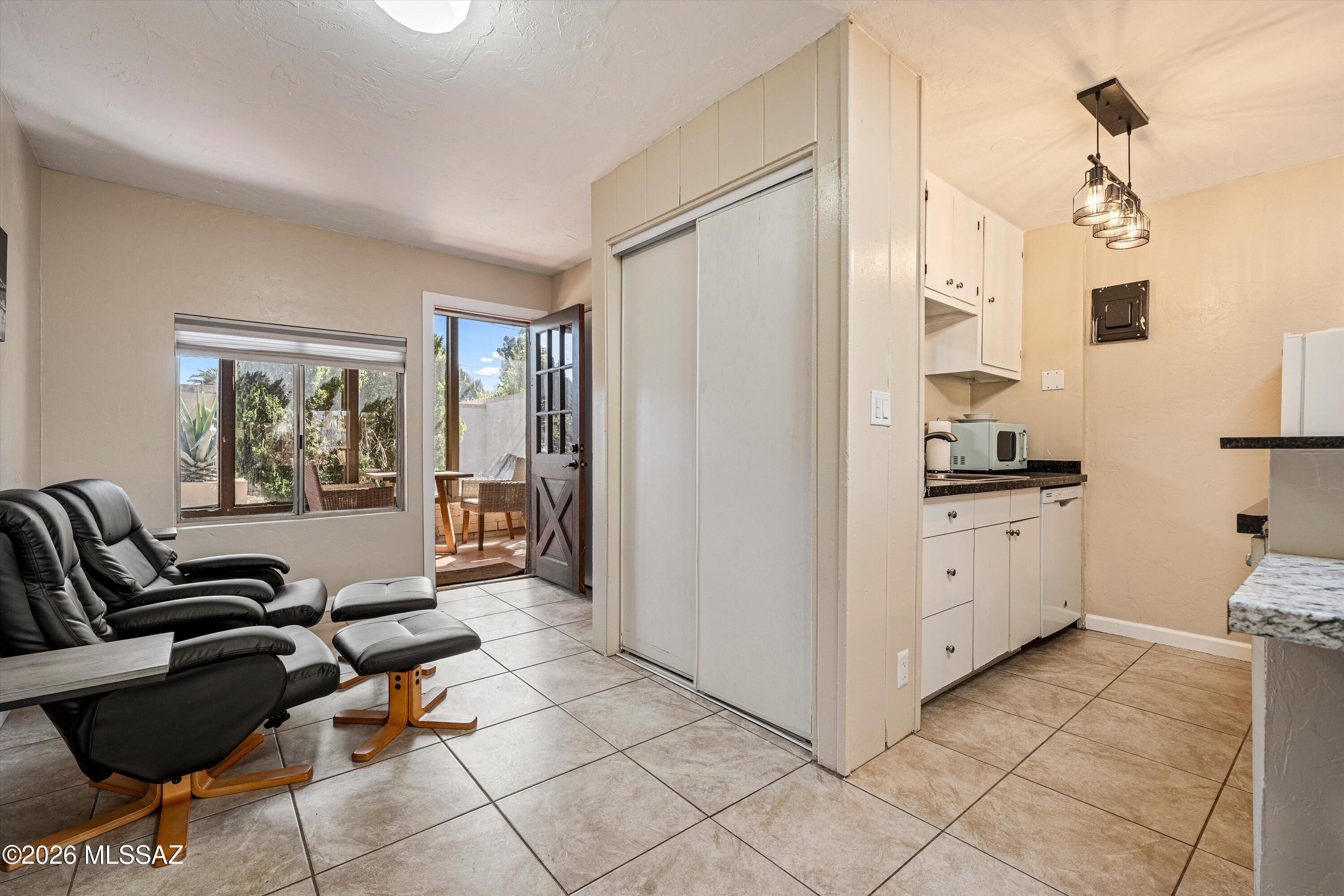 2619 East Prince Road Tucson, AZ 85716 - Photo 29 of 50 a living room with furniture and a window