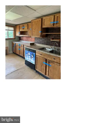a kitchen with stainless steel appliances a stove and a microwave