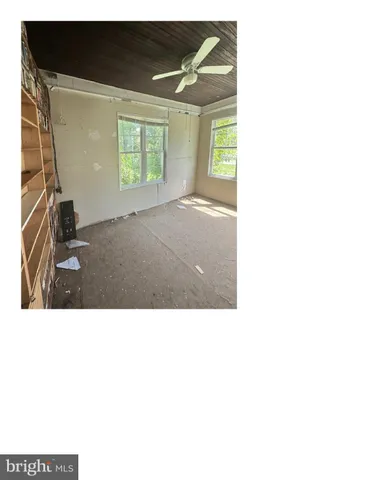 a black and white photo of a living room