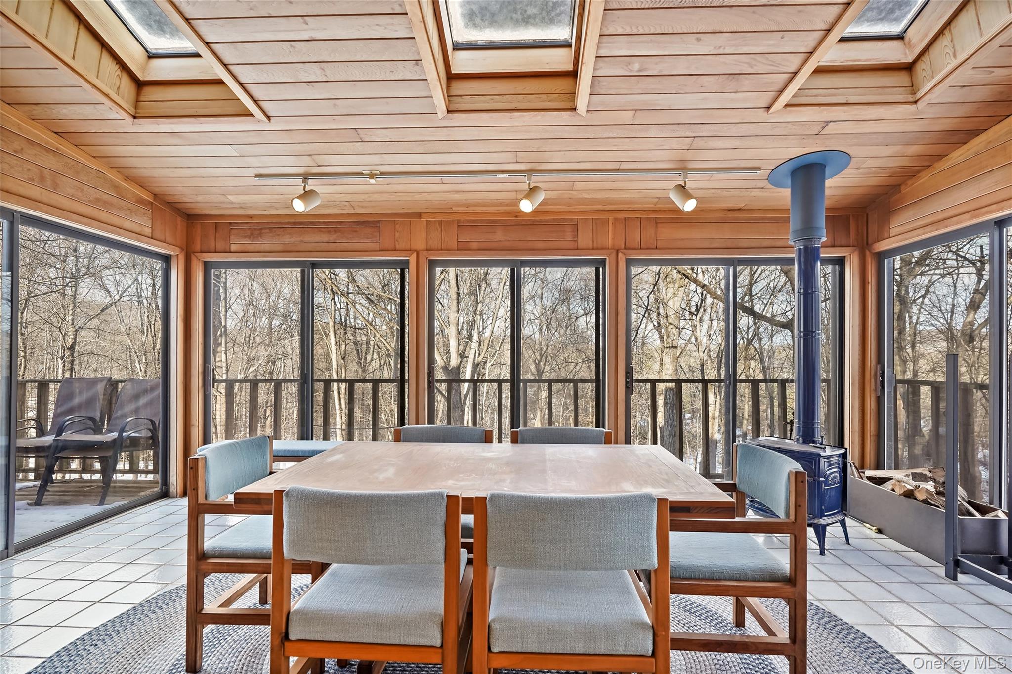 37 Fox Den Road Mount Kisco, NY 10549 - Photo 12 of 24 Enclosed porch with wood burning stove