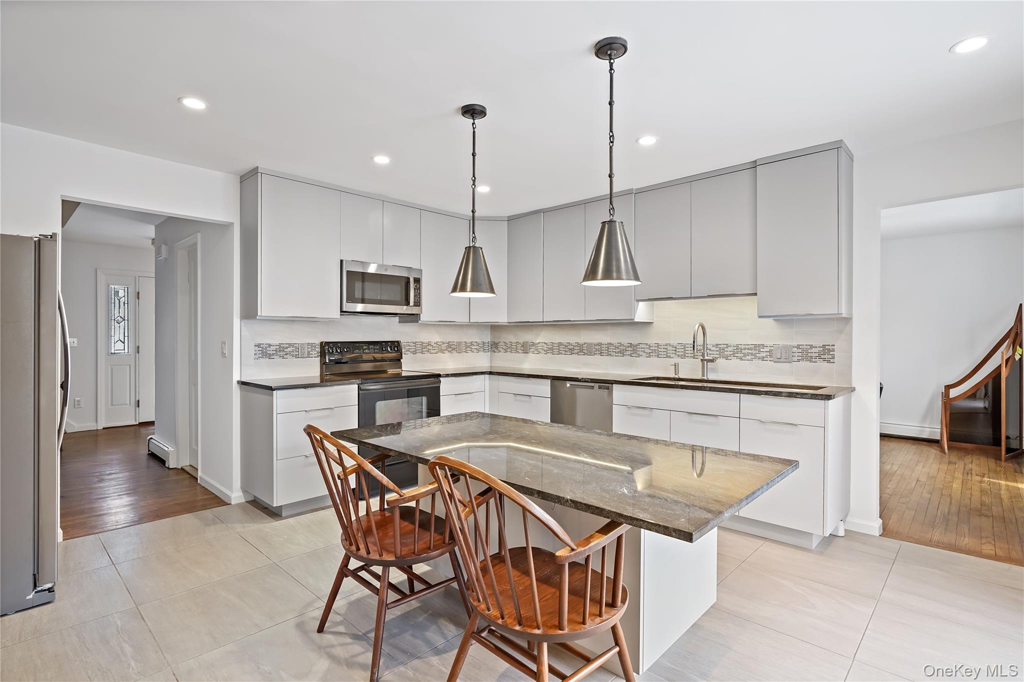 37 Fox Den Road Mount Kisco, NY 10549 - Photo 4 of 24 Newly renovated kitchen with custom cabinetry and oversized granite center island