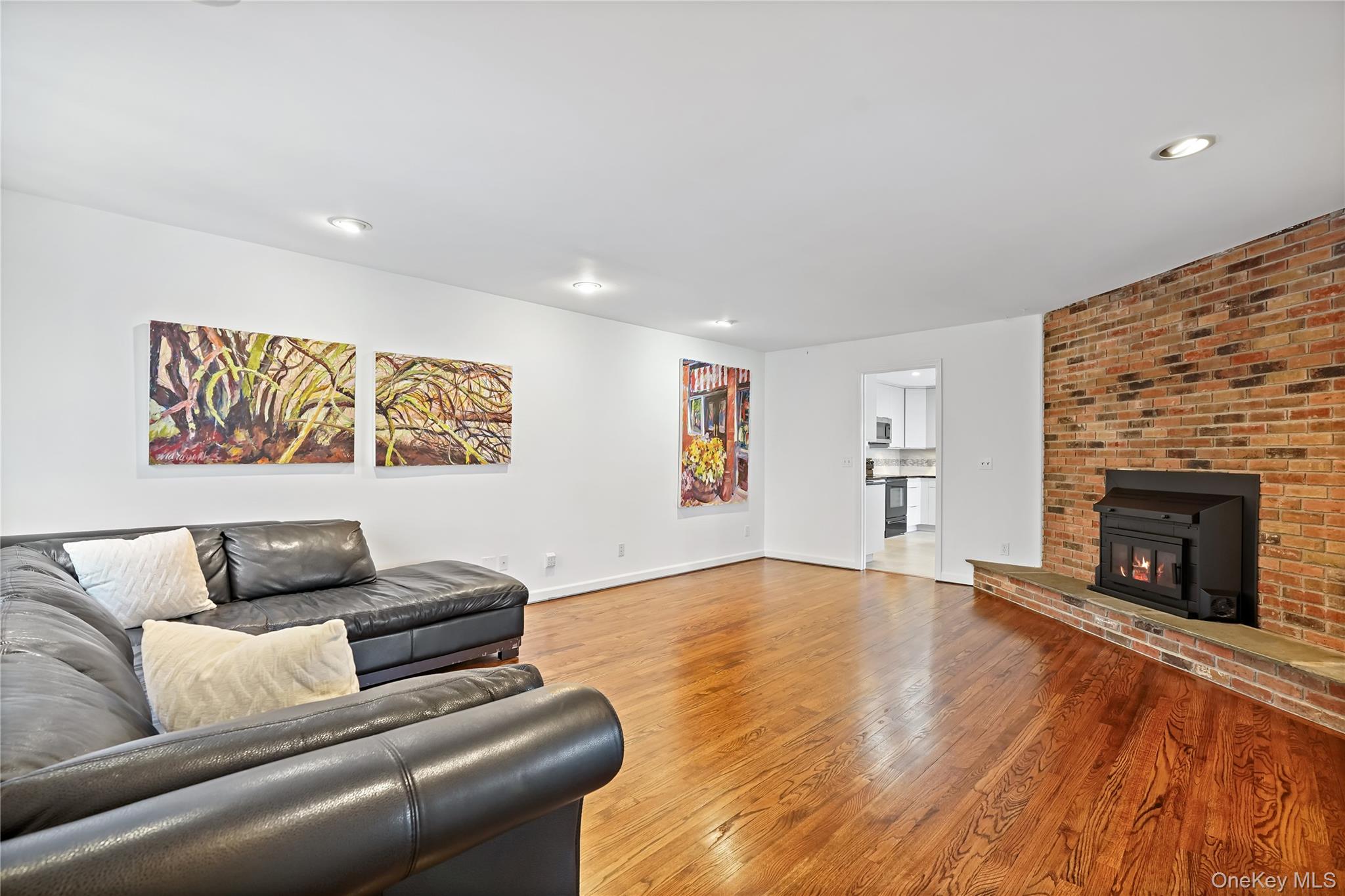 37 Fox Den Road Mount Kisco, NY 10549 - Photo 10 of 24 Gorgeous family room with fireplace with wood burning insert and access to porch and kitchen