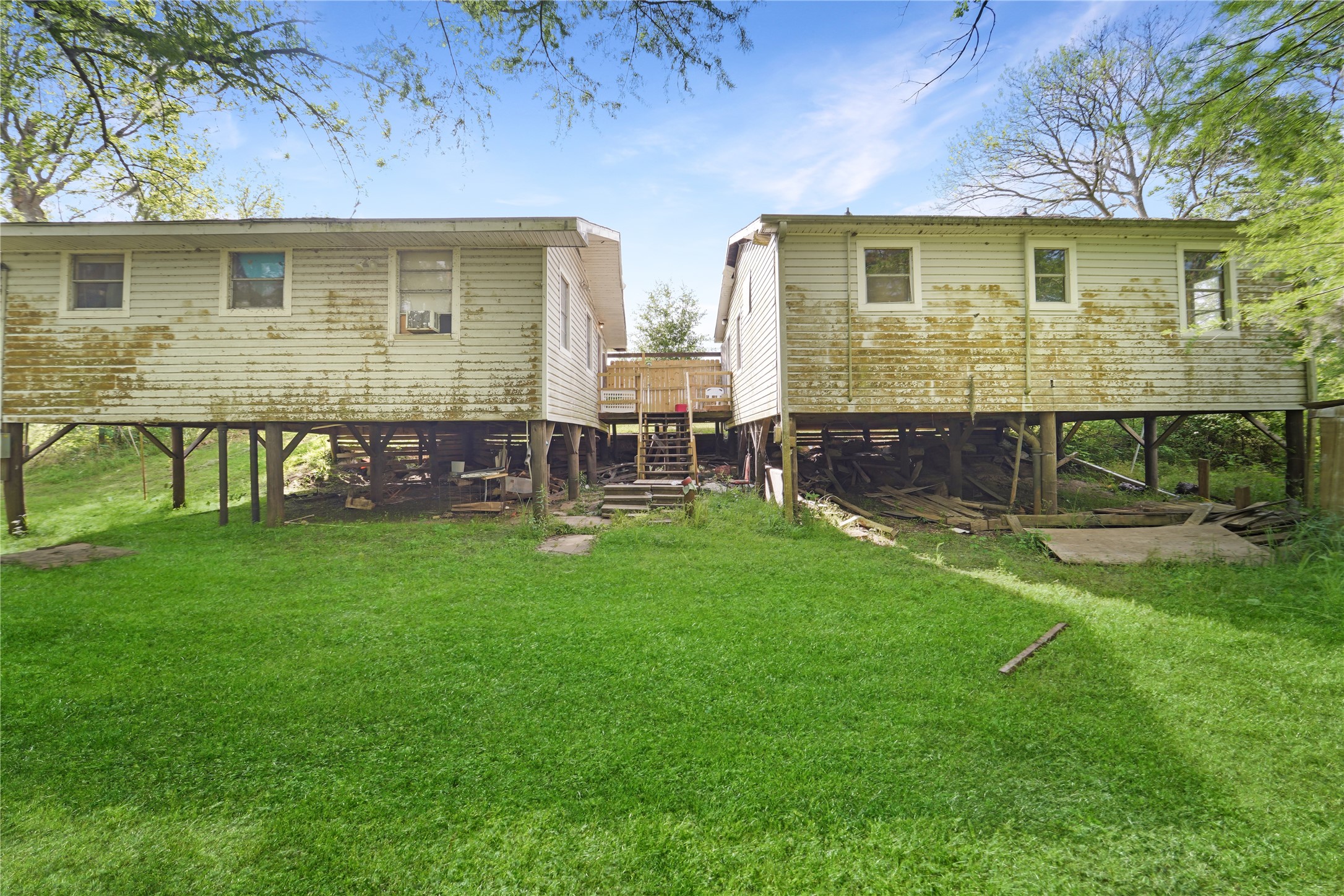 691 County Road 1333 Liberty, TX 77575 - Photo 1 of 24 a view of house with backyard and a chair