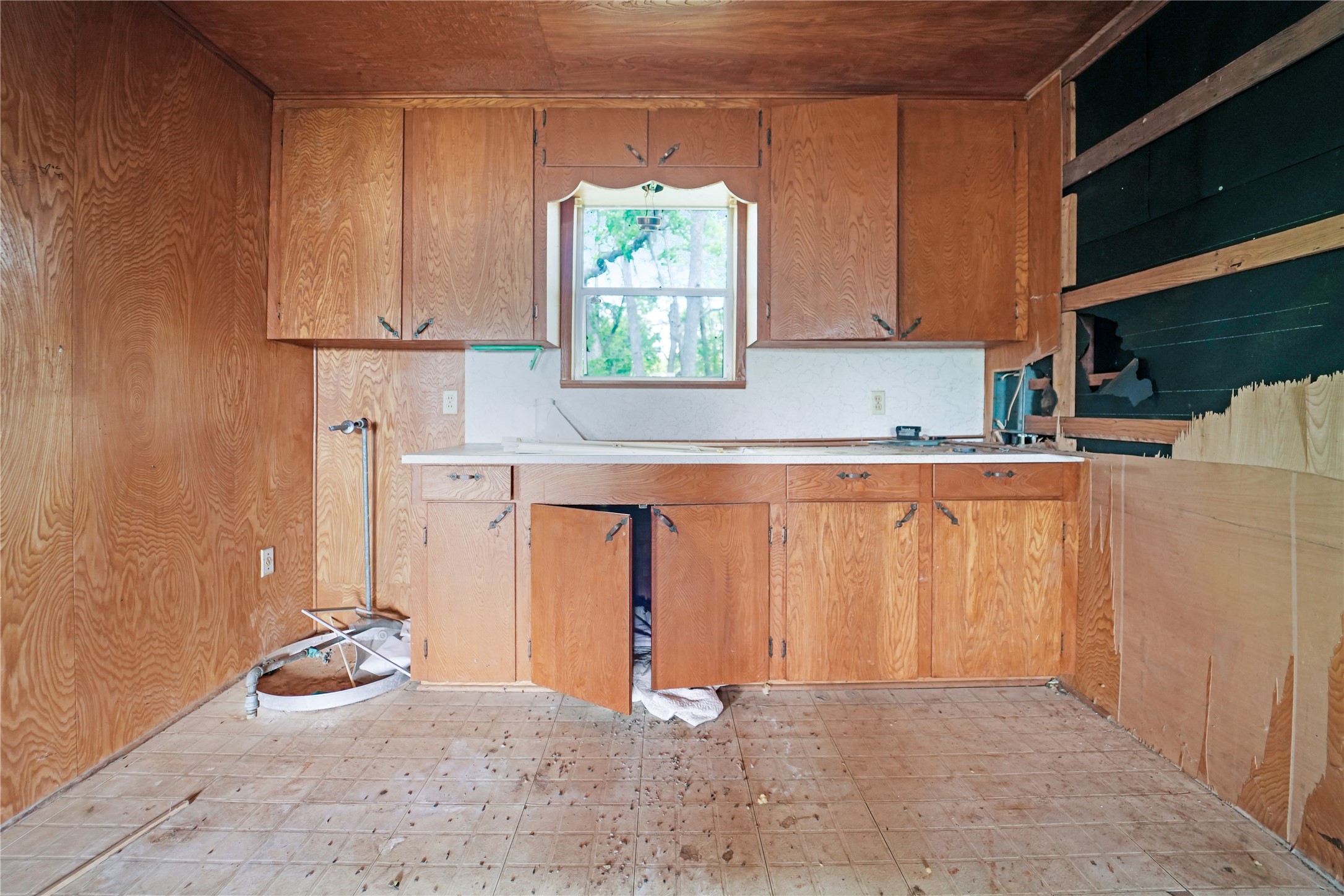 691 County Road 1333 Liberty, TX 77575 - Photo 18 of 24 a kitchen with a window a sink and a cabinets