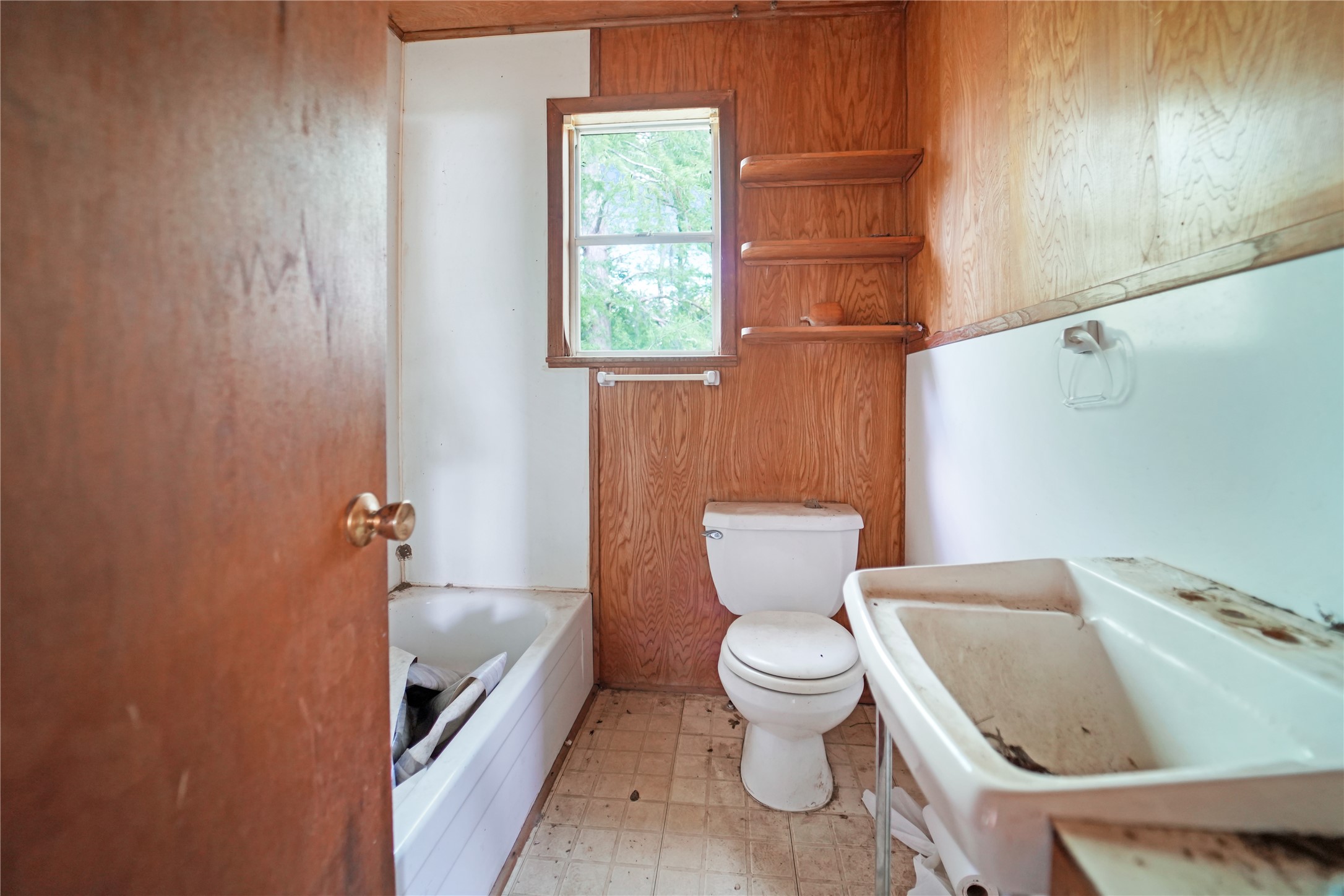 691 County Road 1333 Liberty, TX 77575 - Photo 21 of 24 a white toilet sitting next to a bathroom sink and tub