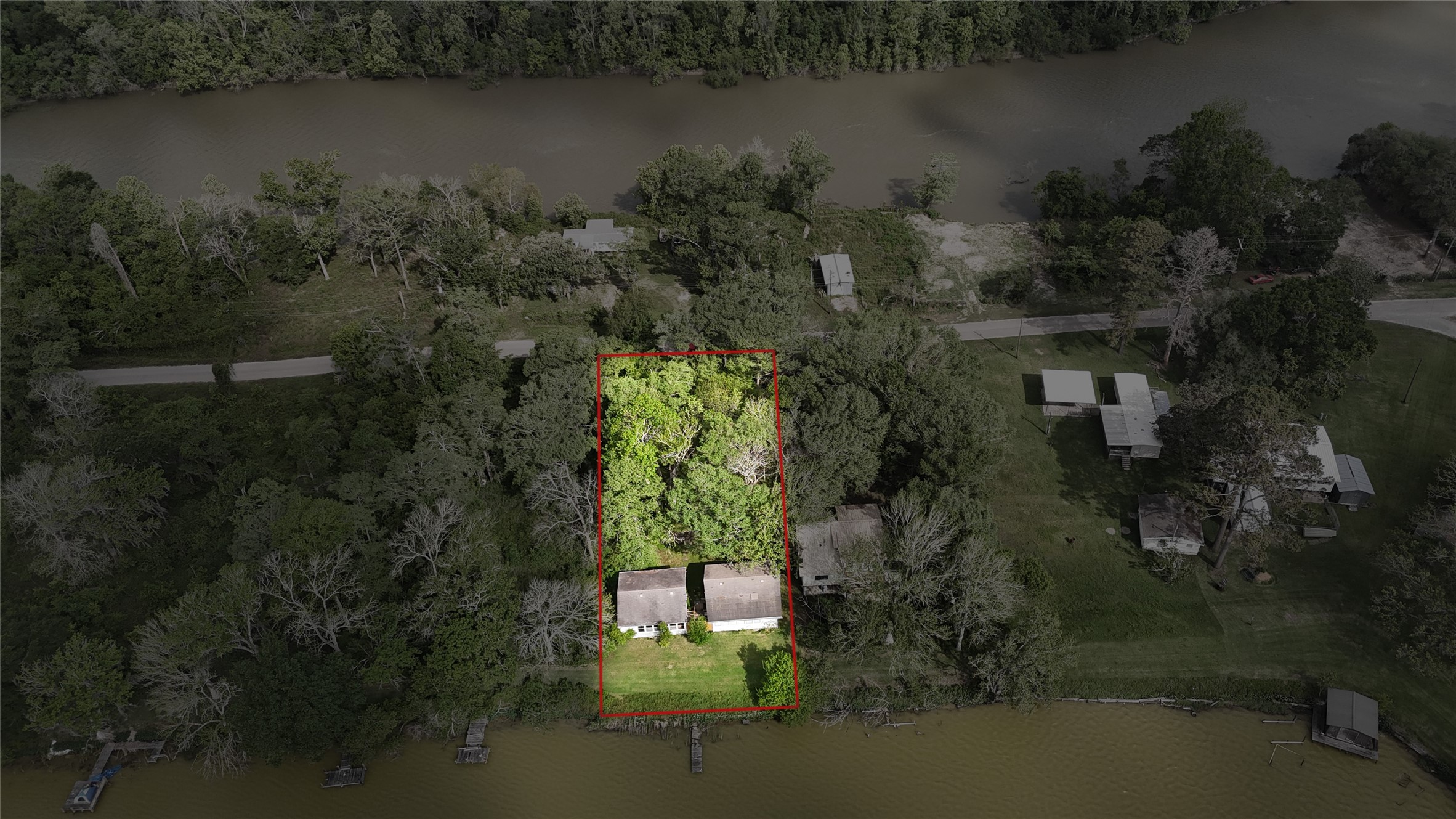 691 County Road 1333 Liberty, TX 77575 - Photo 3 of 24 an aerial view of residential house with outdoor space and lake view
