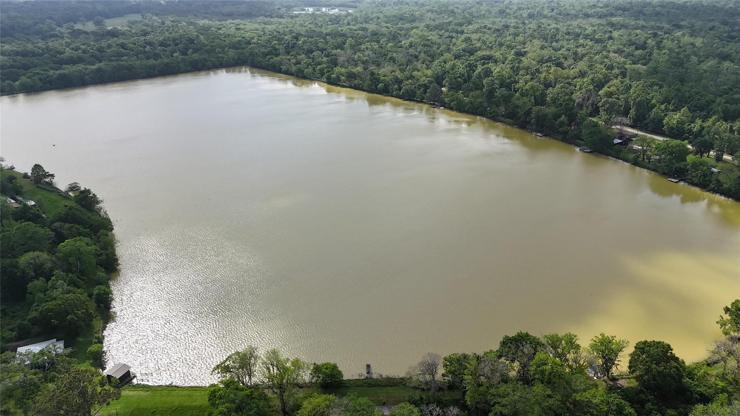 691 County Road 1333 Liberty, TX 77575 - Photo 5 of 24 an aerial view of a houses with lake view