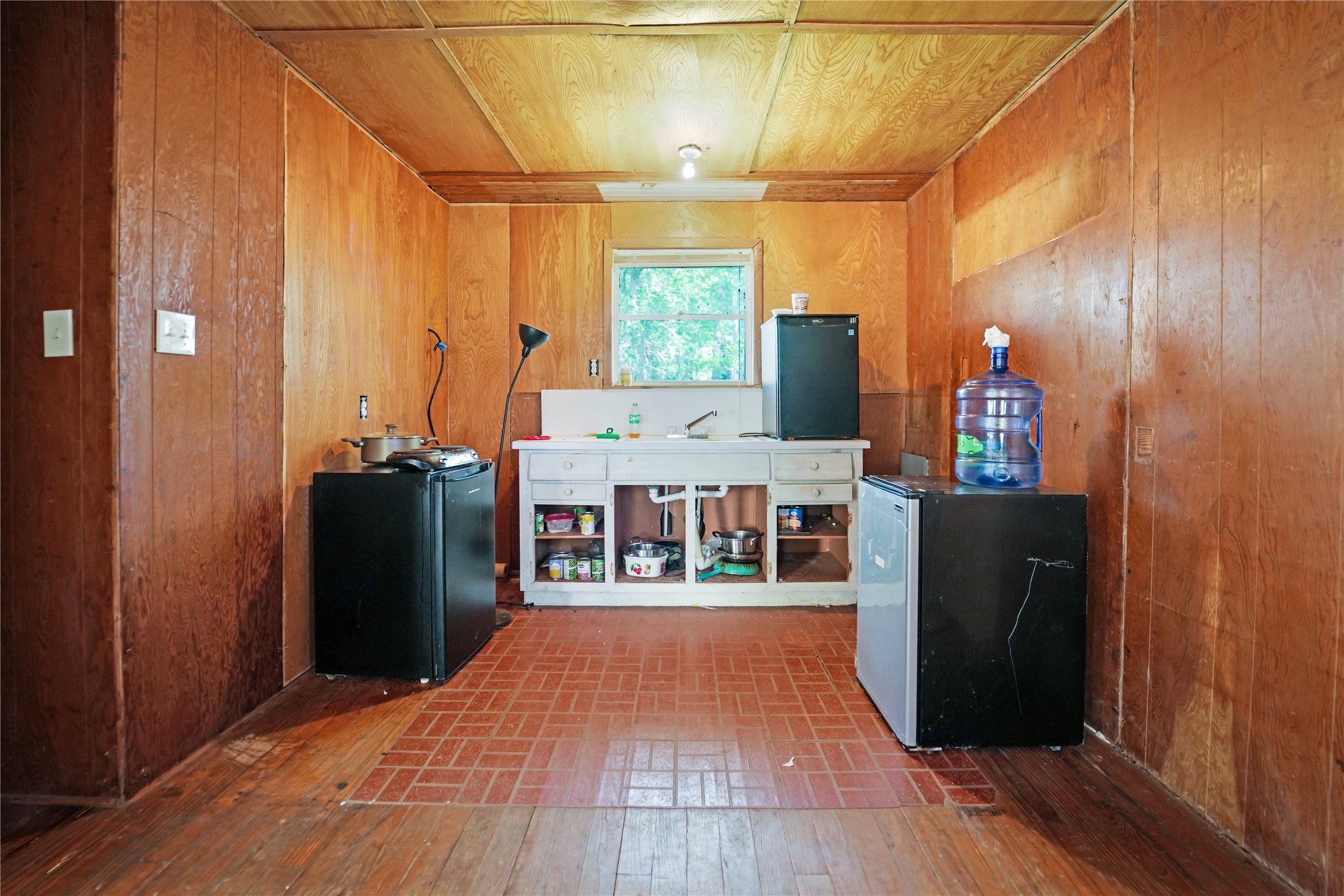 691 County Road 1333 Liberty, TX 77575 - Photo 10 of 24 a view of a hallway with wooden floor and staircase