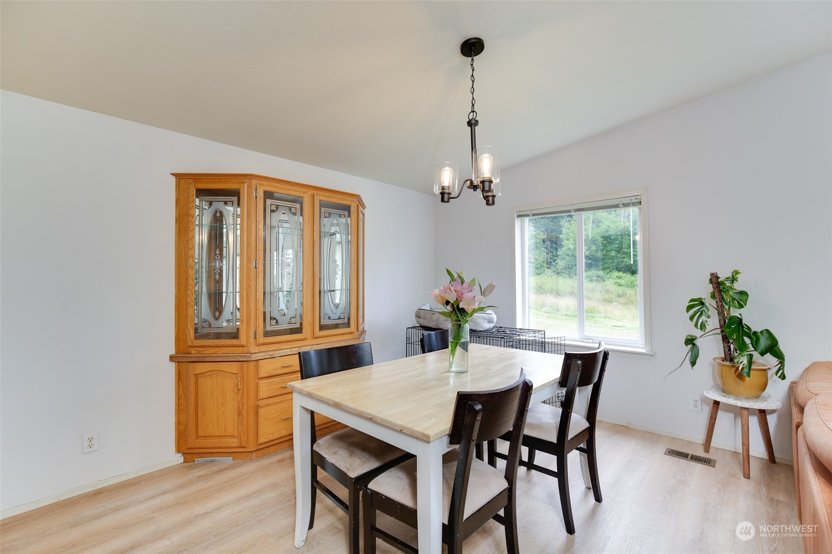 3374 Best Road Oak Harbor, WA 98277 - Photo 11 of 39 a view of a dining room with furniture window and wooden floor
