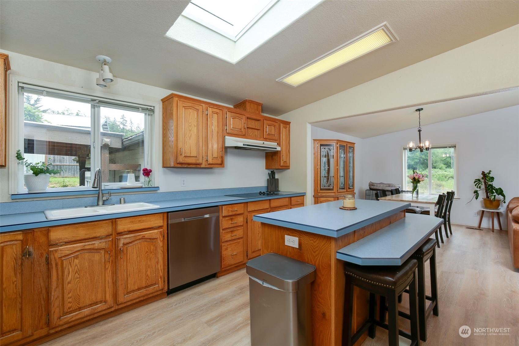 3374 Best Road Oak Harbor, WA 98277 - Photo 14 of 39 a kitchen with a table chairs and wooden floor