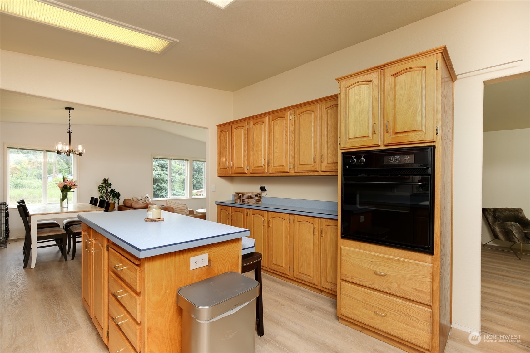 3374 Best Road Oak Harbor, WA 98277 - Photo 15 of 39 a kitchen with stainless steel appliances granite countertop a stove a sink dishwasher and a refrigerator with wooden floor