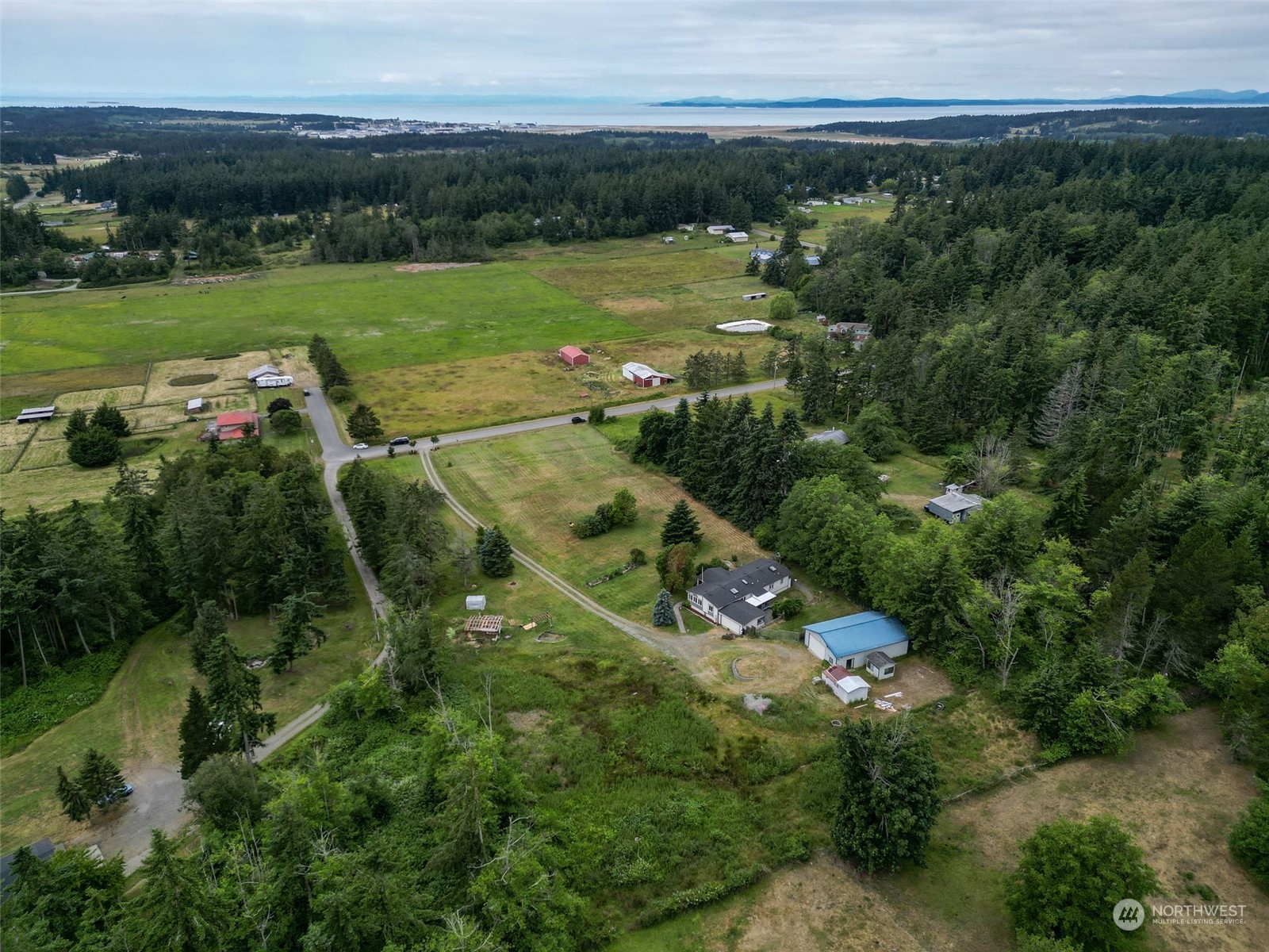 3374 Best Road Oak Harbor, WA 98277 - Photo 3 of 39 an aerial view of a houses with outdoor space and trees all around